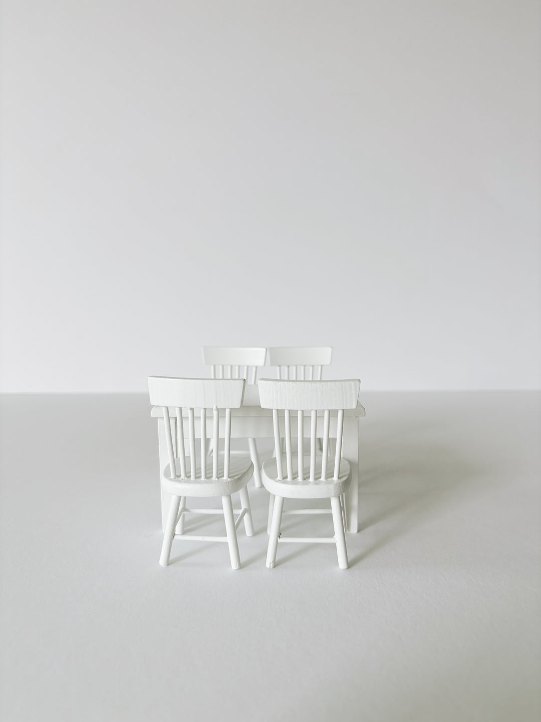 Miniature white dining table and chairs